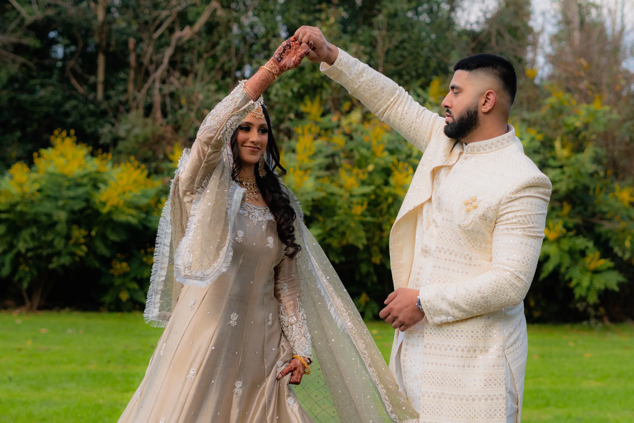Bride twirling with the groom during a wedding portrait