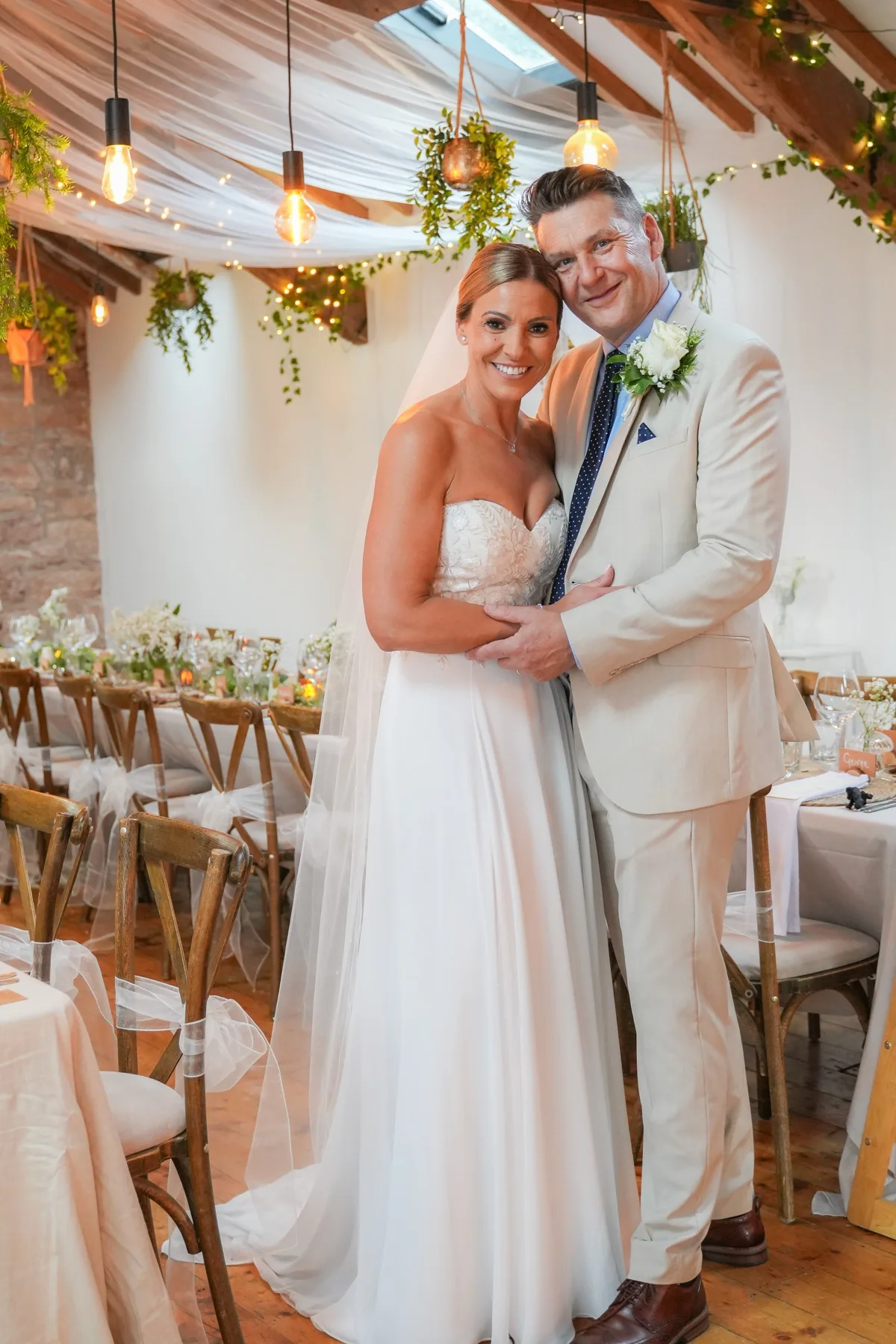 Newly married couple together inside their reception venue
