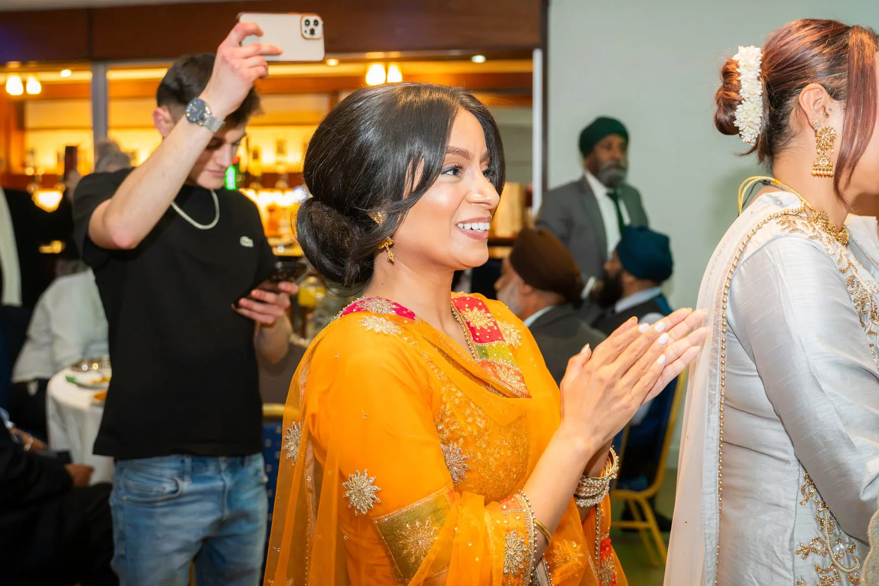 Family members greeting each other during a wedding celebration