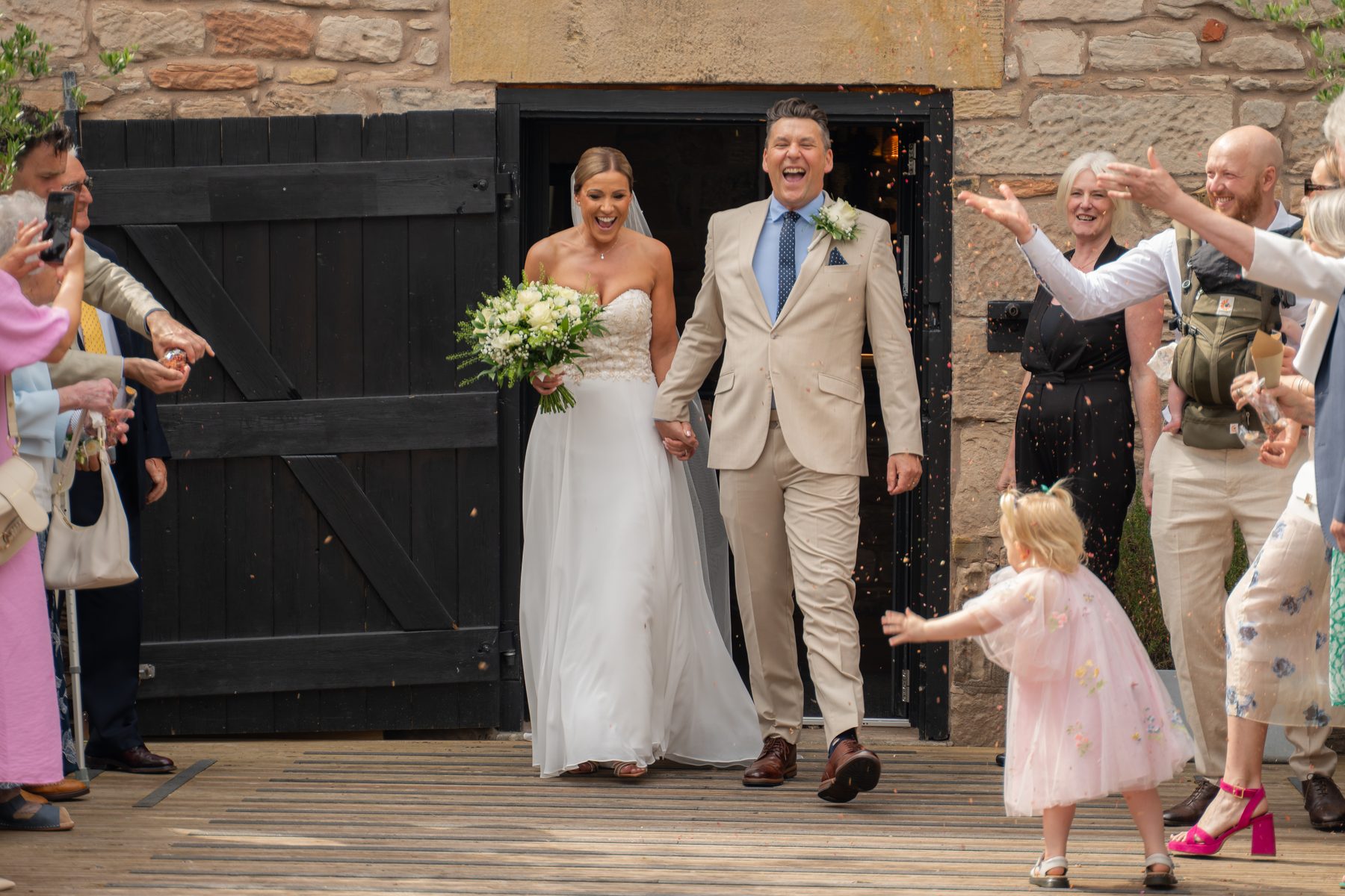Marcus and Emma celebrating with their guests